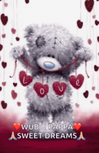 a teddy bear is holding a string of red hearts and says wub u pappa sweet dreams