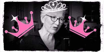 a woman wearing glasses and a pink crown