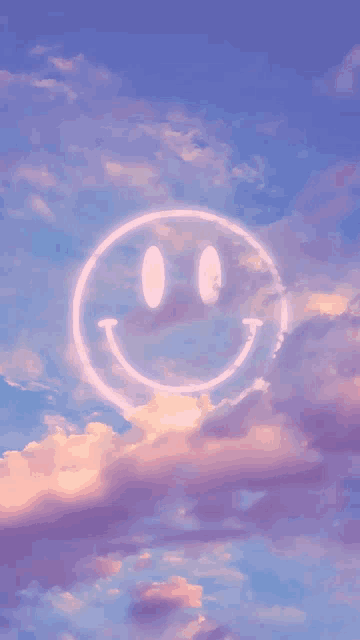 a smiley face is floating in the clouds