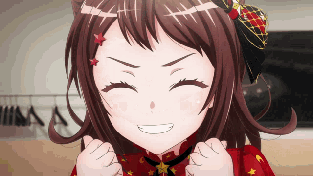 a close up of a girl 's face with her eyes closed and a smile on her face