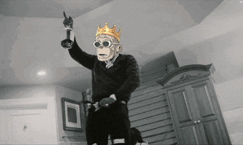 a man wearing a monkey mask and a crown is dancing in a room