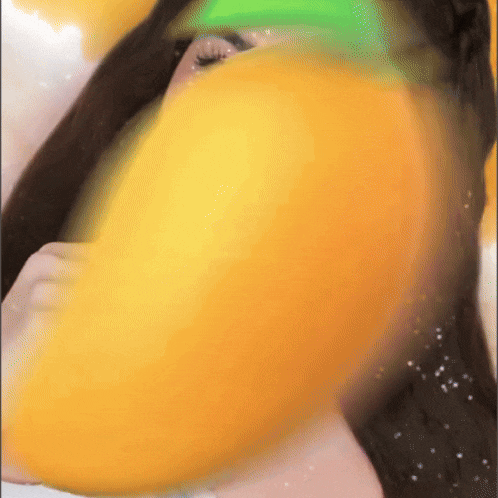 a close up of a woman 's face with a yellow and green colored background