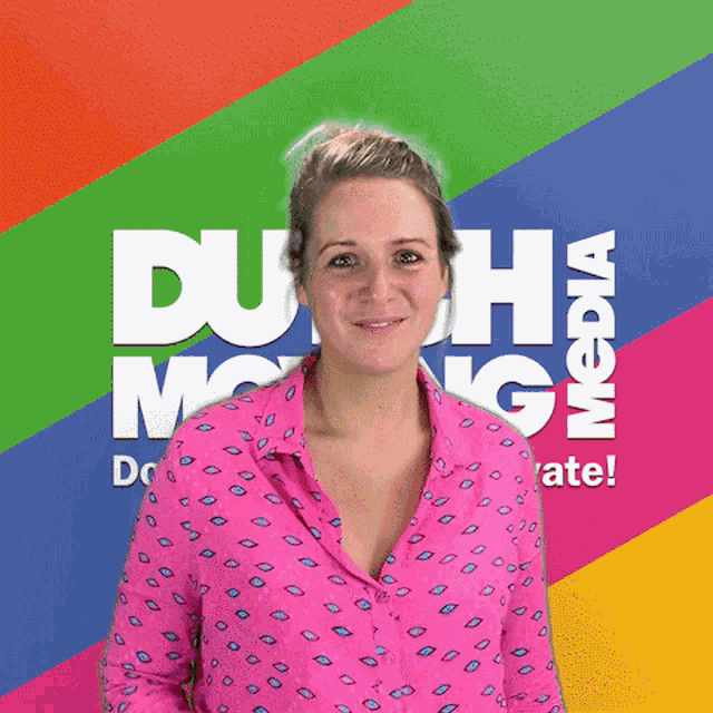 a woman in a pink shirt is standing in front of a colorful background that says " duh media "