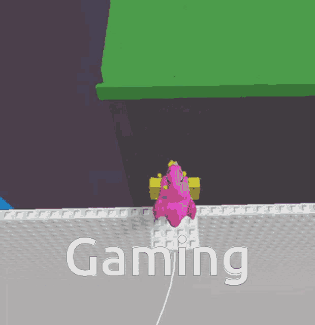 a pink unicorn is sitting on top of a white surface with the words gaming written on it .