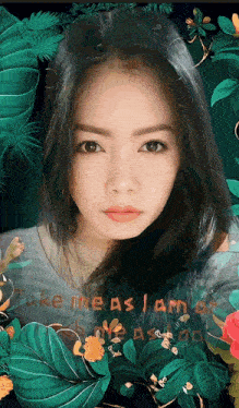 a woman 's face is surrounded by leaves and flowers with the words take me as i am written on the bottom