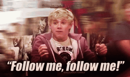 a young man says " follow me follow me " in a blurry photo