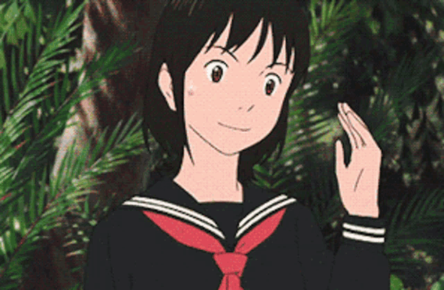 a young girl in a school uniform with a red tie