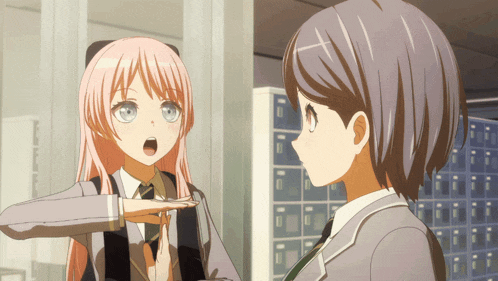 a girl with pink hair is talking to a girl with blue hair