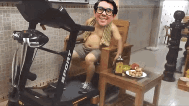 a man is sitting on a treadmill with the word sport on it