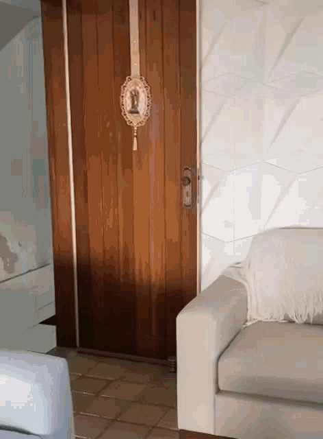a wooden door with a picture of jesus hanging on it