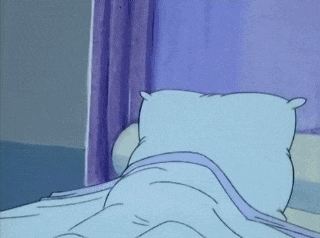 a cartoon character is laying in a hospital bed with a thermometer in his mouth