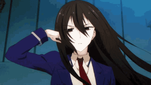 a girl with long black hair is wearing a blue suit and tie