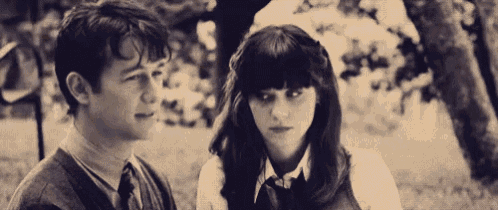a black and white photo of a man and a woman