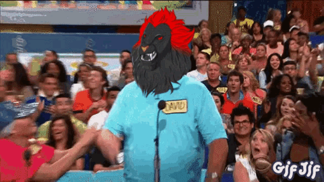 a man with a lion head and a name tag that says david stands in front of a crowd