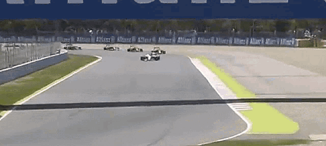 a race track with a blue banner that says allianz