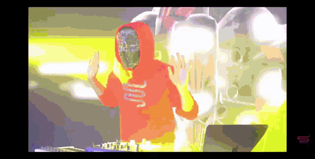 a pixelated image of a person wearing an orange hoodie that says ' jcw ' on it