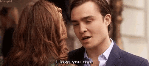 a man and a woman are hugging and the man is saying `` i love you too '' .