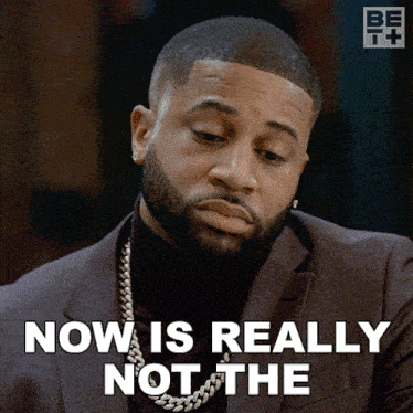 a man in a suit says now is really not the on the screen