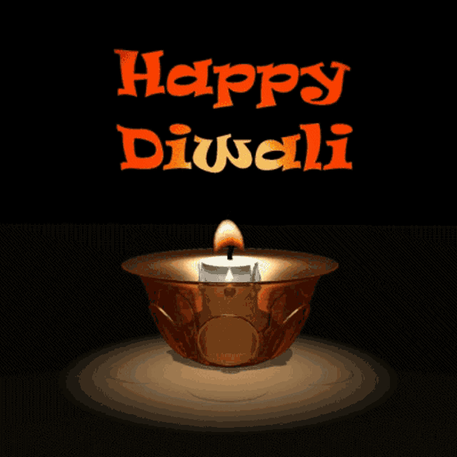 a candle in a bowl that says happy diwali on it