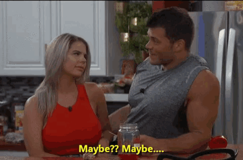 a man and a woman are sitting at a table and the woman says maybe maybe