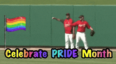 two baseball players celebrate pride month on a field