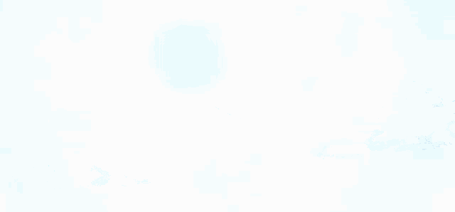 a blue sky with white clouds and a light shining through