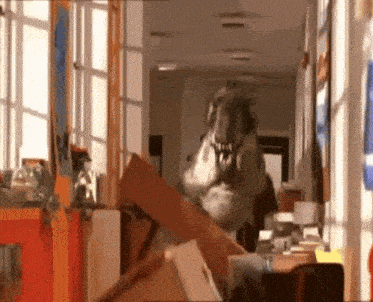 a t-rex is walking through a hallway with a bunch of boxes