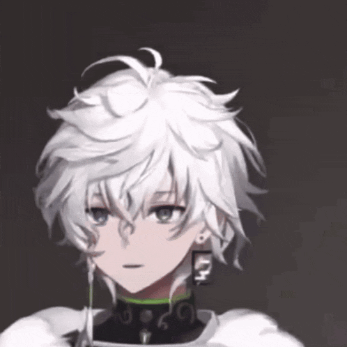 a close up of a person 's face with white hair and earrings with the letter m on them