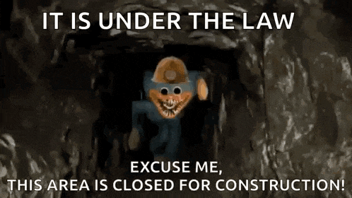 a cartoon character is standing in a cave with a sign that says `` it is under the law '' .