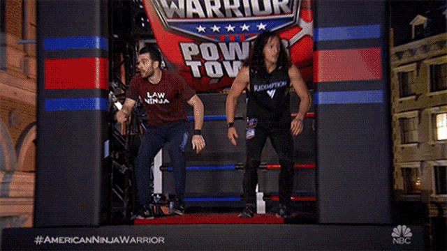 a man and a woman are jumping in front of a sign that says ninja warrior power tower