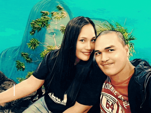 a man wearing a red shirt with the number 64 on it is sitting next to a woman