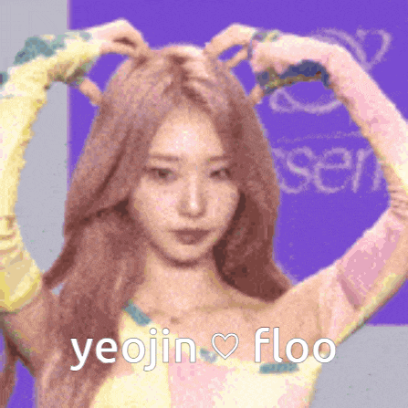 a woman making a heart with her hands and the words yeojin floo