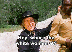 a man in a cowboy hat is talking to another man with the words hey where the white women at