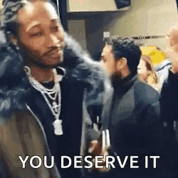 a man is smoking a cigarette and saying `` you deserve it '' while standing in a crowd of people .