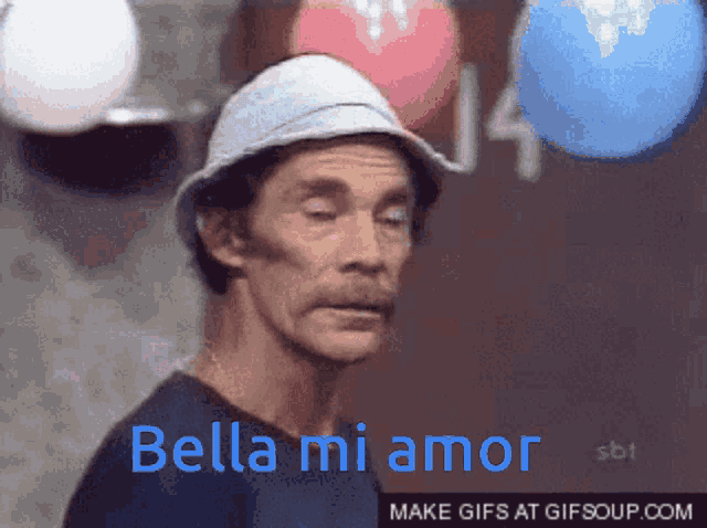 a man wearing a hat with the words bella mi amor written on it