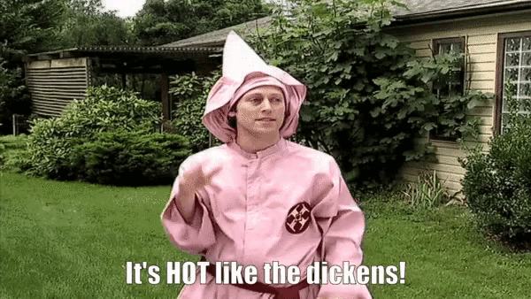 a man in a pink robe is standing in front of a house and says it 's hot like the dickens