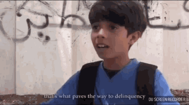 a young boy in a blue shirt says that 's what paves the way to delinquence