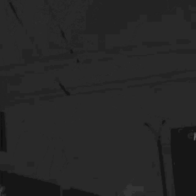 a black and white photo of a lightning bolt hitting a building .
