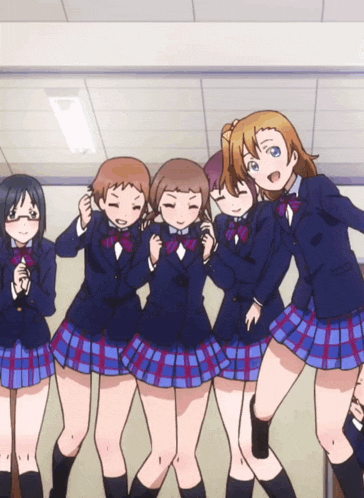 a group of anime girls posing for a picture together