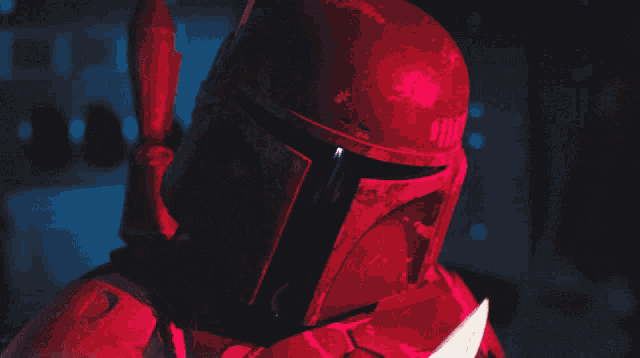 a close up of a person holding a red light