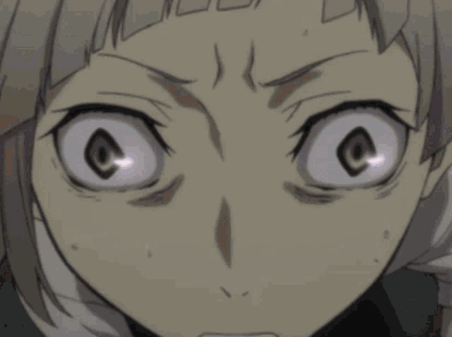 a close up of a cartoon character 's face with a surprised look on his face