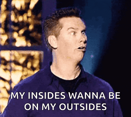 a man with a surprised look on his face is saying " my insides wanna be on my outsides "