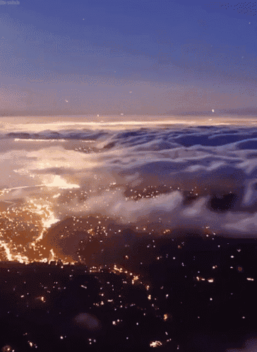 an aerial view of a city lit up at night