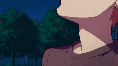 a close up of a person 's neck in a dark forest