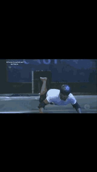 a man in a helmet is laying in a pool of water with a sign that says ' alonso ' on it