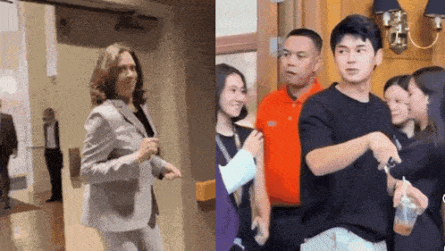 a woman in a suit and a man in an orange shirt are walking down a hallway