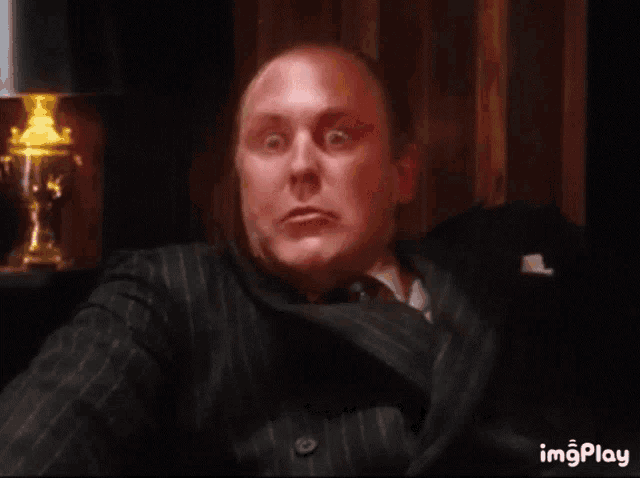 a man with a surprised look on his face with the words for free behind him