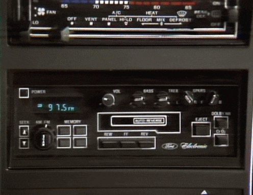 a close up of a car radio that says 97.5 fm on the screen