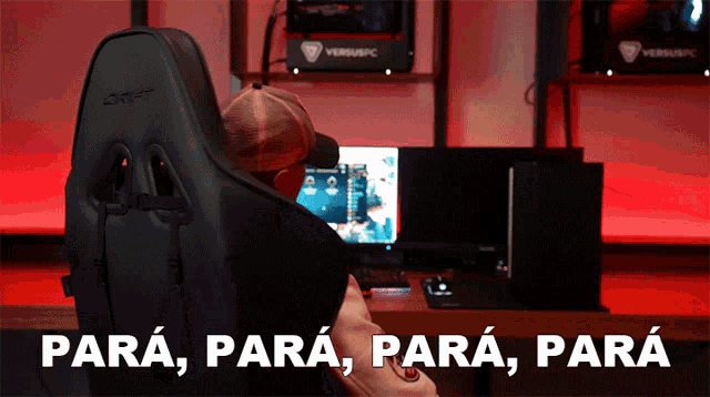 a man sits in a chair in front of a computer with the words para para para written on the bottom