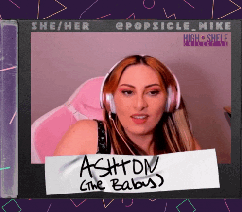 a woman wearing headphones and a sign that says ashton the baby